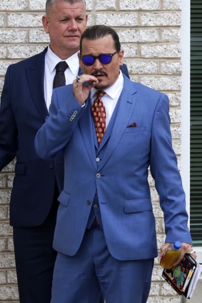 Johnny Depp Smokes, Wears Suit