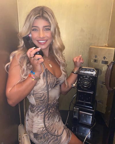 Gia Giudice Poses in a Phonebooth