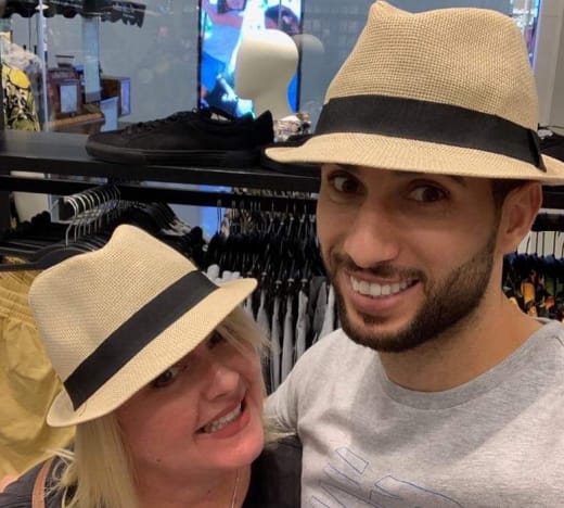 Laura and Aladin Try on Hats