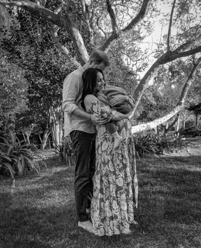 Prince Harry and Meghan Markle and Archie in Black and White