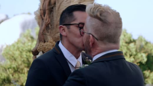 Kenneth Niedermeier and Armando Rubio kiss at the altar
