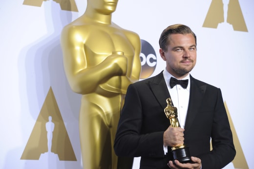 Leonardo DiCaprio Holds His Best Actor Oscar in the Press Room