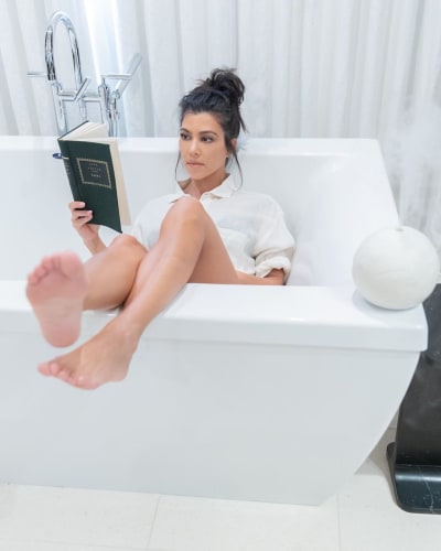 Kourtney Kardashian "Reads" in the Bathtub