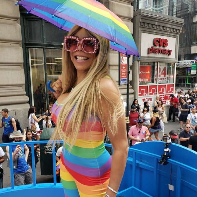 Wendy Williams had a rainbow umbrella to match her outfit as she celebrated...