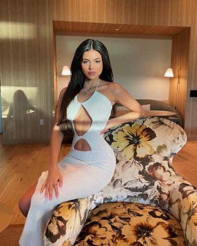 Holly Scarfon in a pastel dress